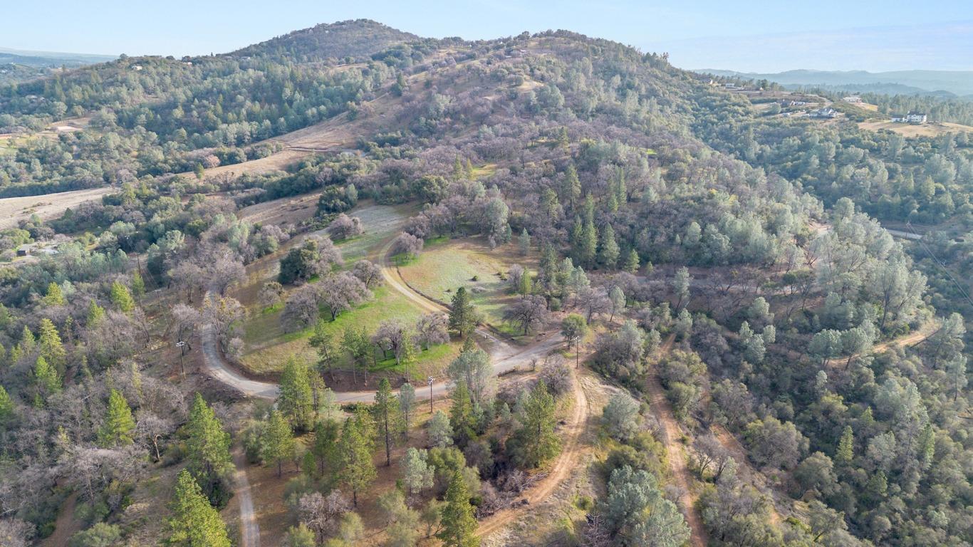 4890 Thompson Hill Road Placerville, CA 95667 - Photo 9 of 15 a view of a mountain in the distance in a field