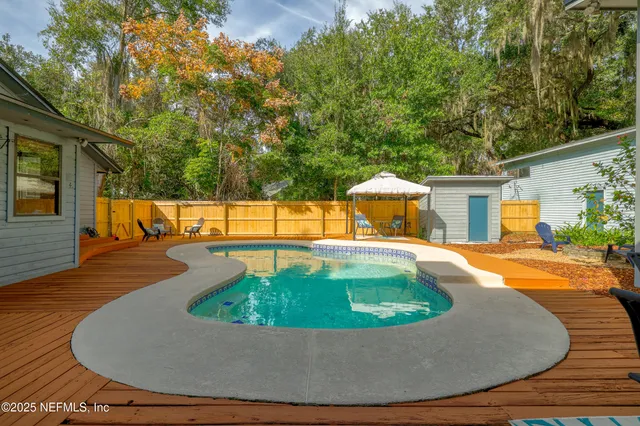 a view of a house with swimming pool
