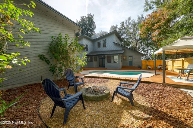 a swimming pool with outdoor seating