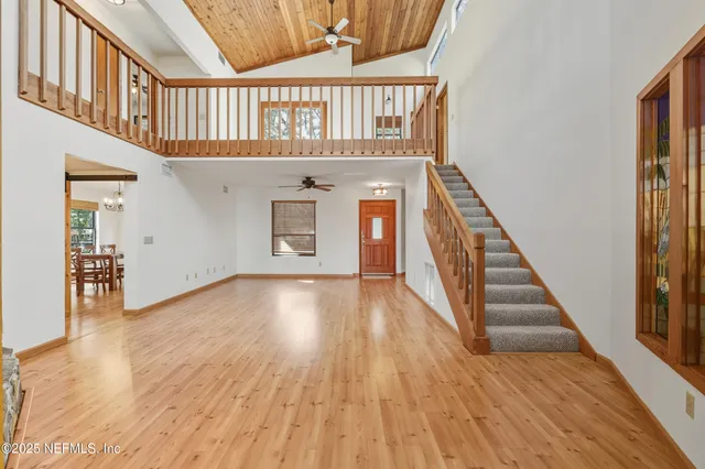 a view of an entryway with wooden floor