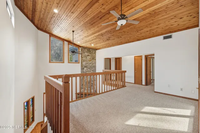a view of a hallway with stairs
