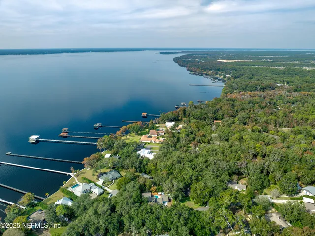 a view of a lake with a yard