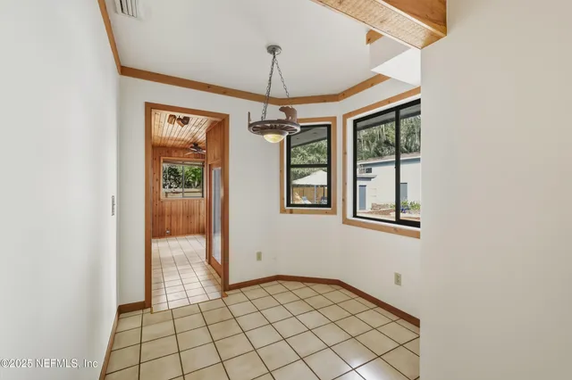 a view of a hallway with windows