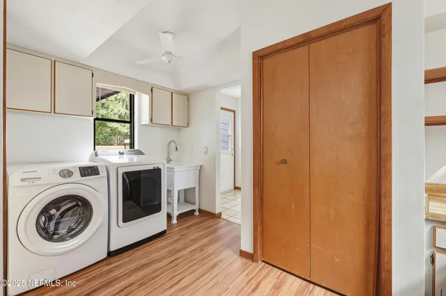 a view of a kitchen with washer and dryer