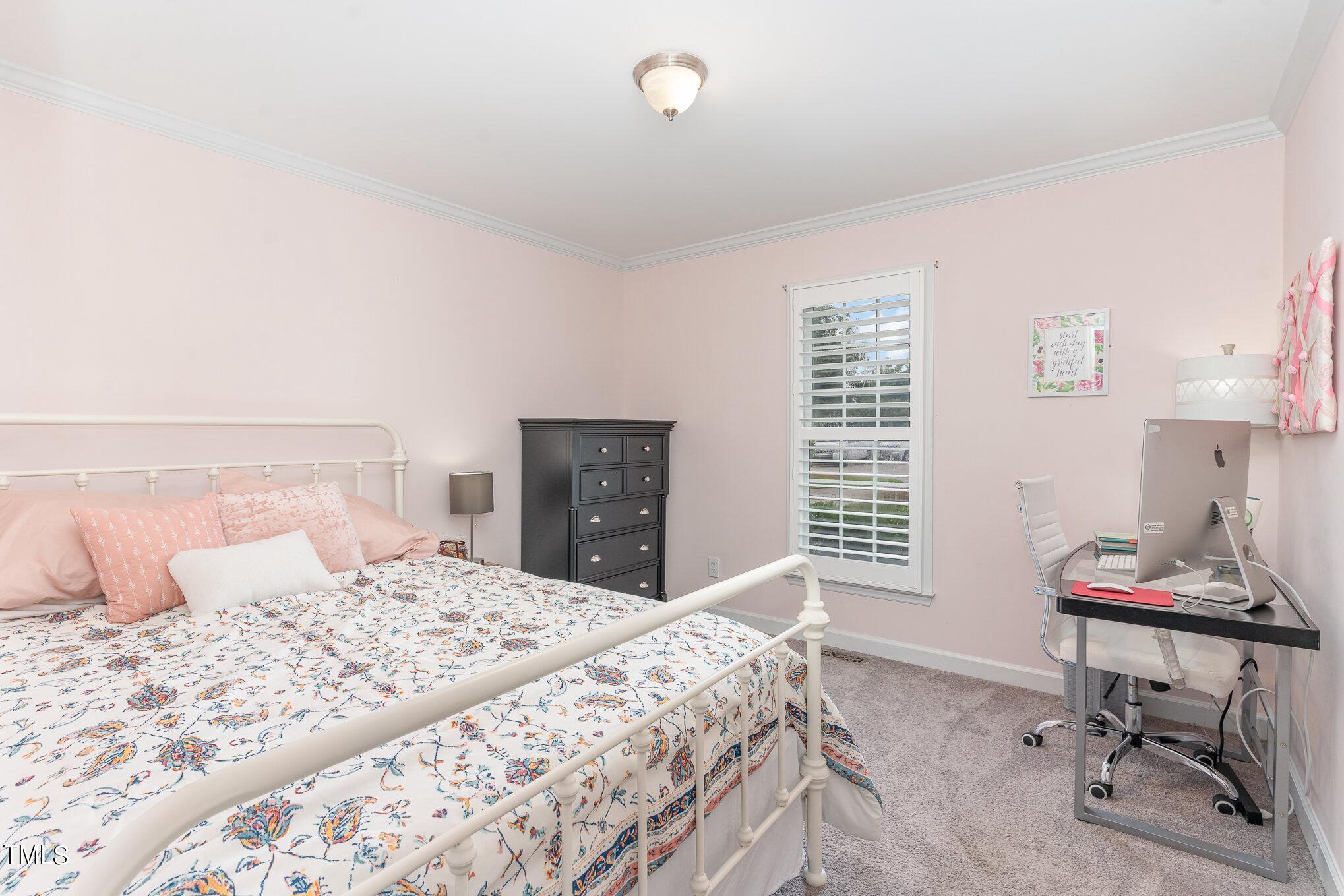 3224 Terrel Mill Road Raleigh, NC 27616 - Photo 13 of 21 a bedroom with a bed and a table in it