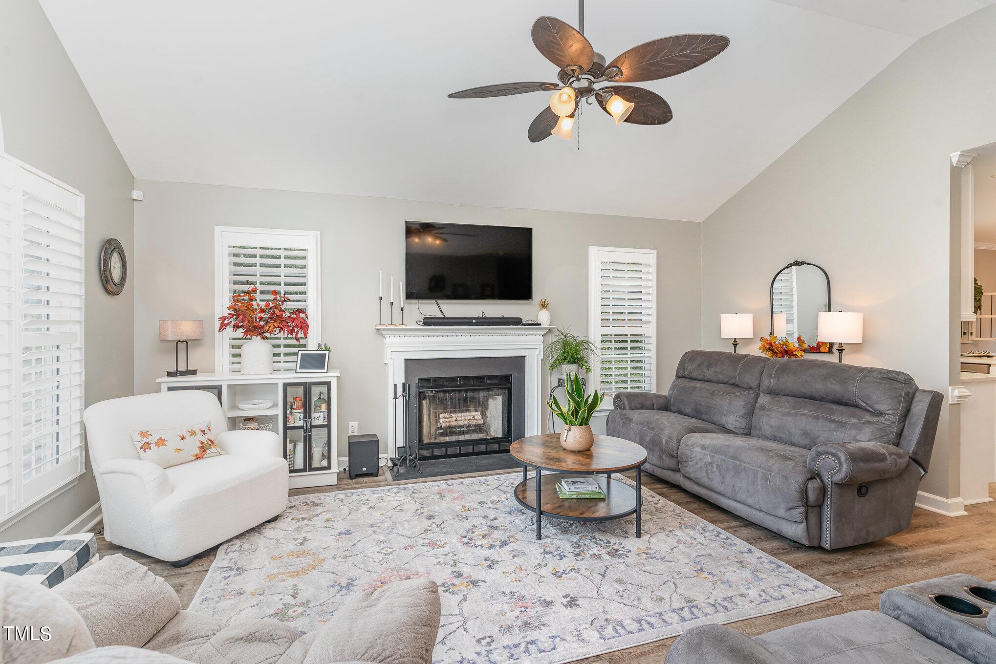 3224 Terrel Mill Road Raleigh, NC 27616 - Photo 4 of 21 a living room with furniture a fireplace and a flat screen tv