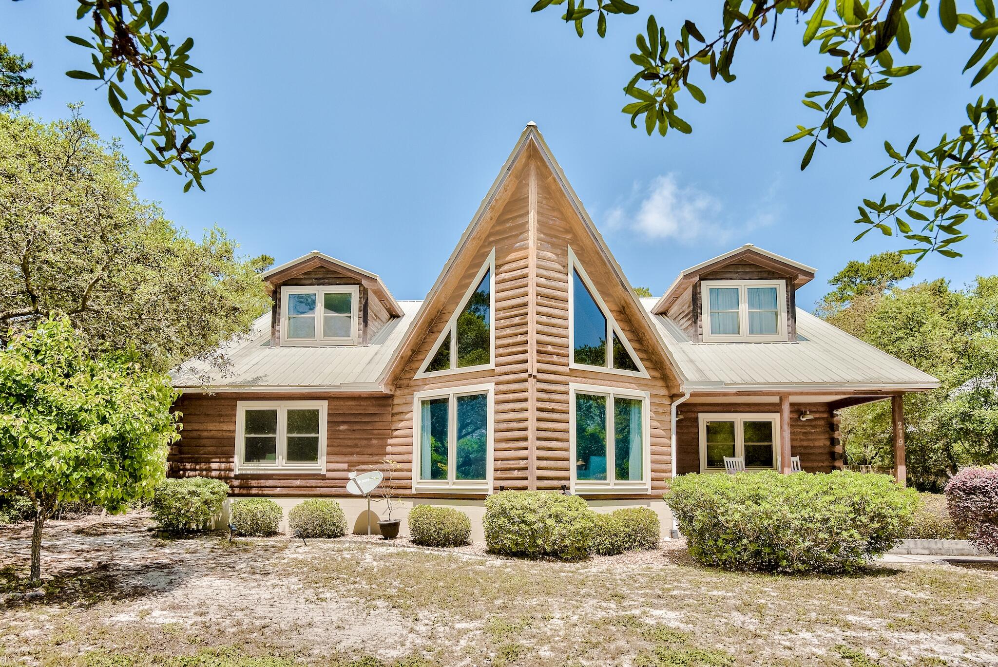 279 Pinewood Lane Inlet Beach, FL 32461 - Photo 1 of 48 a front view of a house with a yard