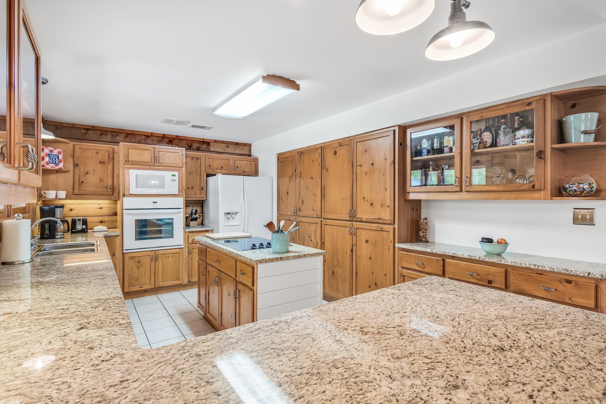 279 Pinewood Lane Inlet Beach, FL 32461 - Photo 18 of 48 a kitchen with a stove a refrigerator and a sink