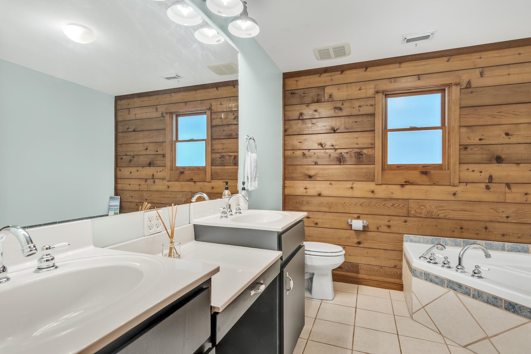 279 Pinewood Lane Inlet Beach, FL 32461 - Photo 24 of 48 a bathroom with a sink and a mirror