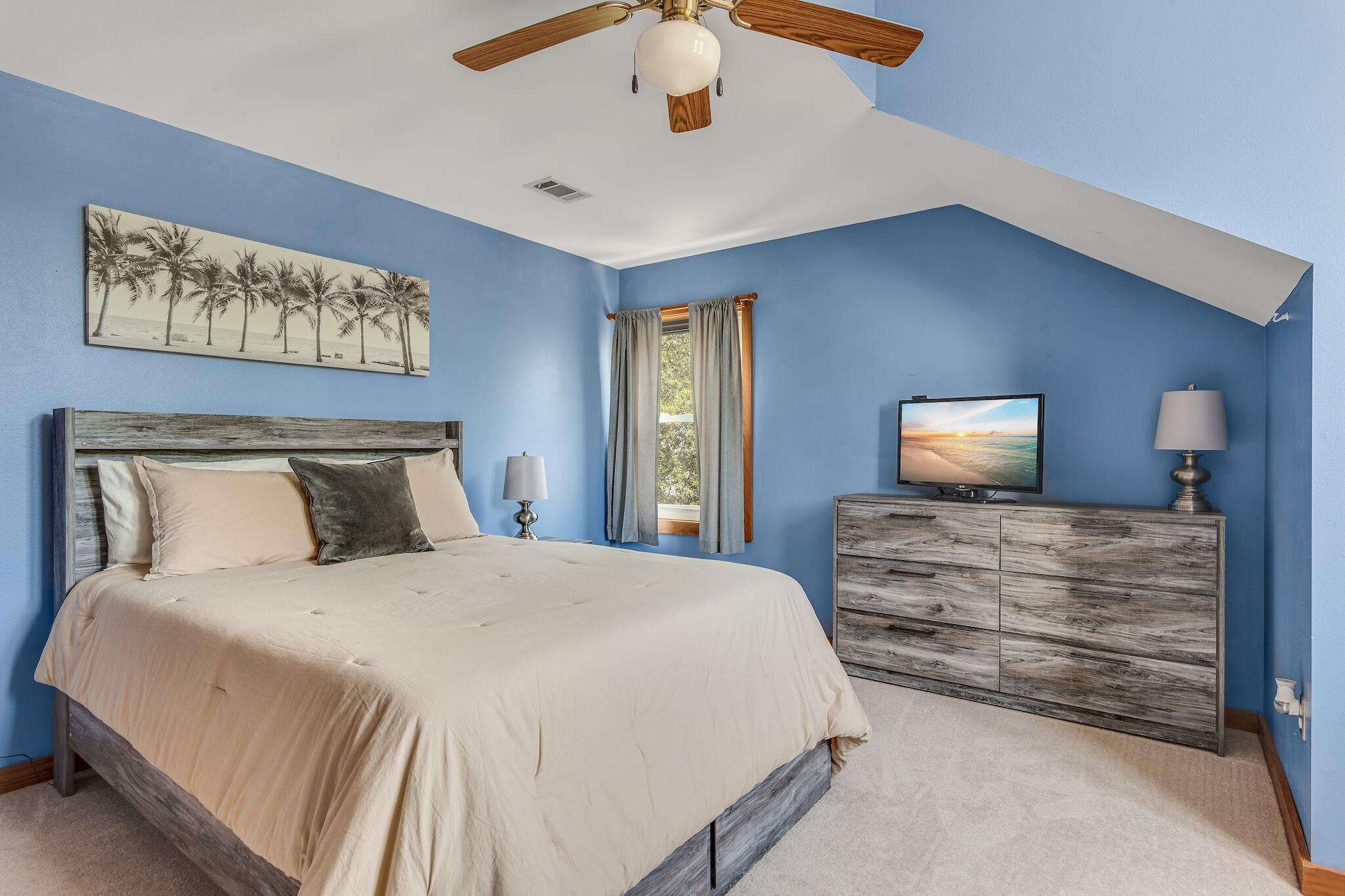 279 Pinewood Lane Inlet Beach, FL 32461 - Photo 30 of 48 a bedroom with a bed and a chandelier