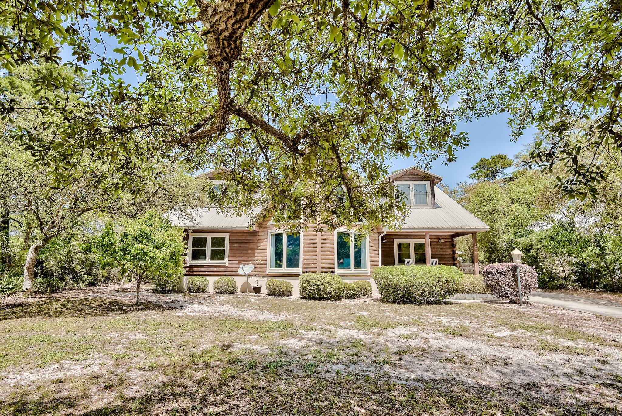 279 Pinewood Lane Inlet Beach, FL 32461 - Photo 3 of 48 a front view of a house with a yard