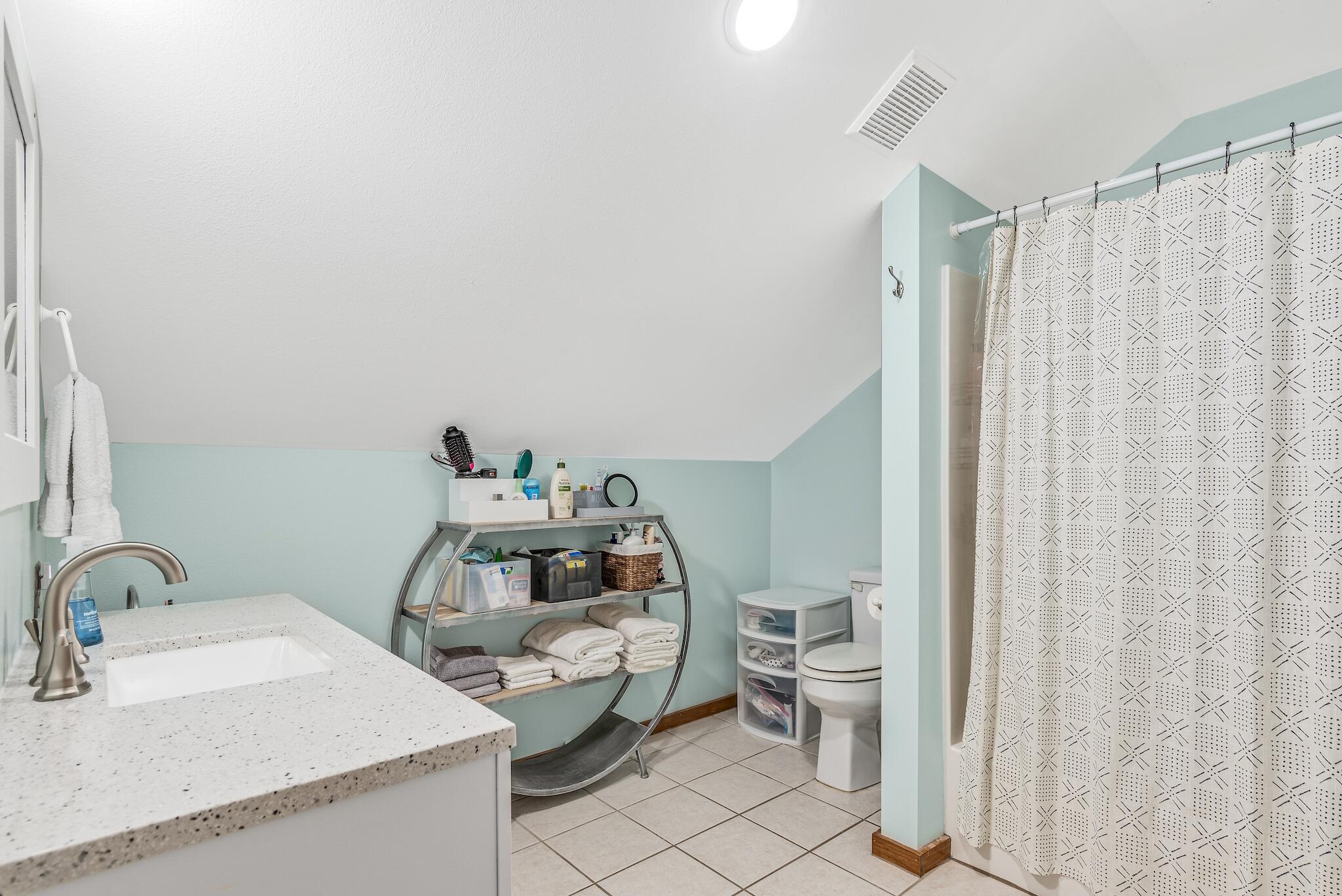 279 Pinewood Lane Inlet Beach, FL 32461 - Photo 31 of 48 a bathroom with a sink and a toilet