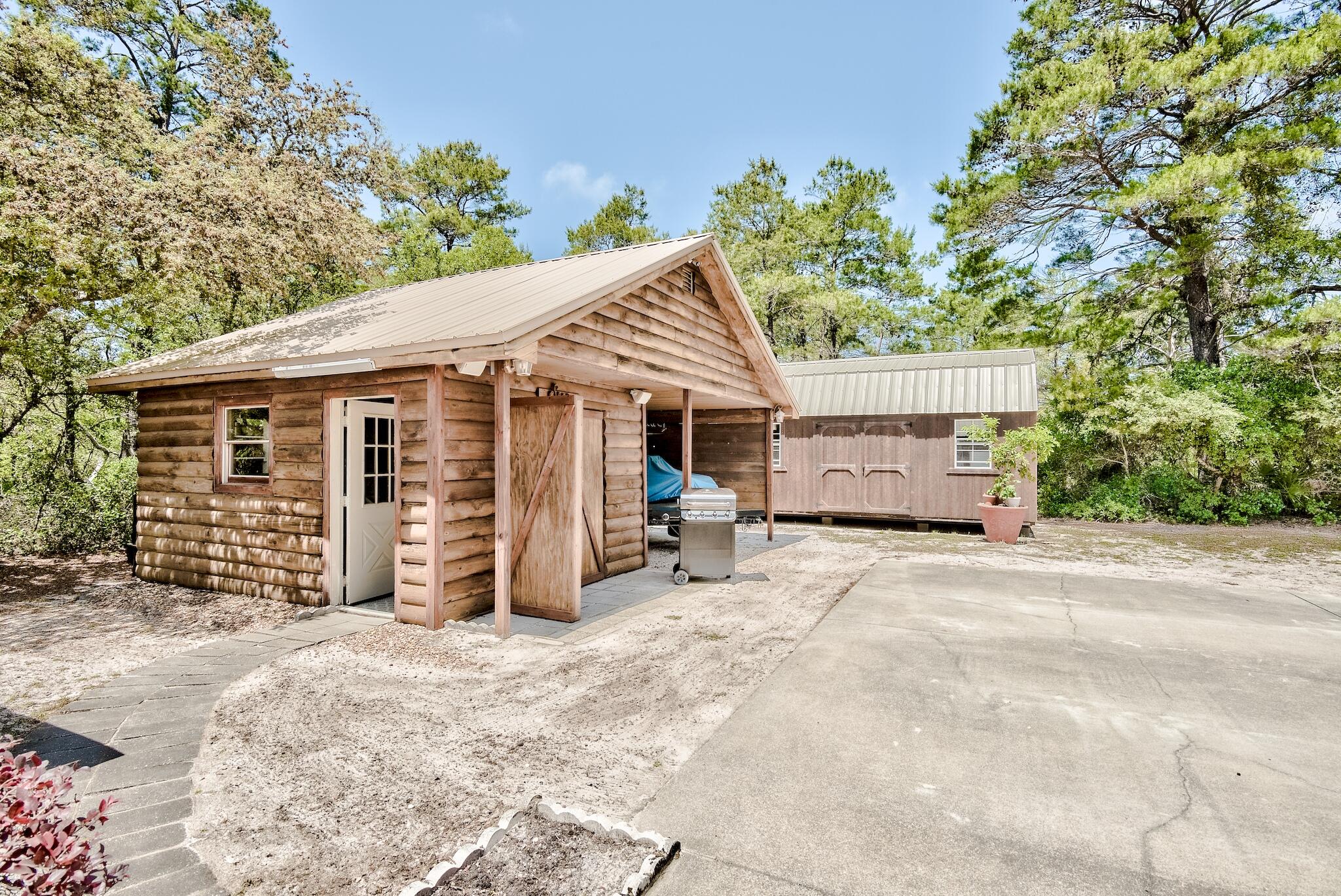 279 Pinewood Lane Inlet Beach, FL 32461 - Photo 37 of 48 a view of a house with a patio