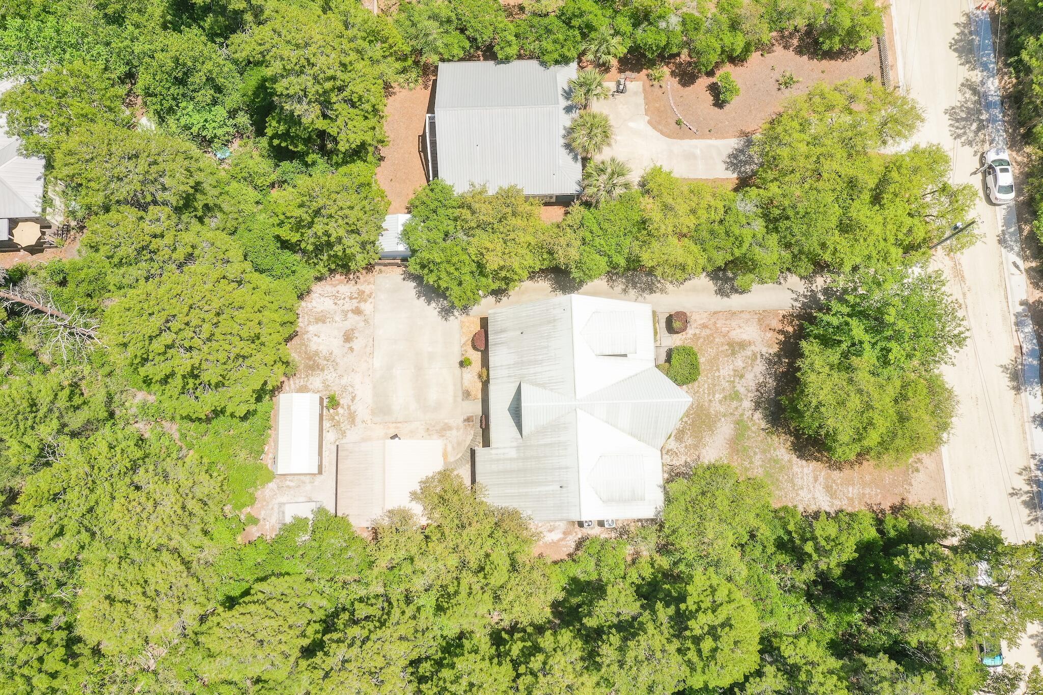 279 Pinewood Lane Inlet Beach, FL 32461 - Photo 42 of 48 an aerial view of a house with a yard and trees all around