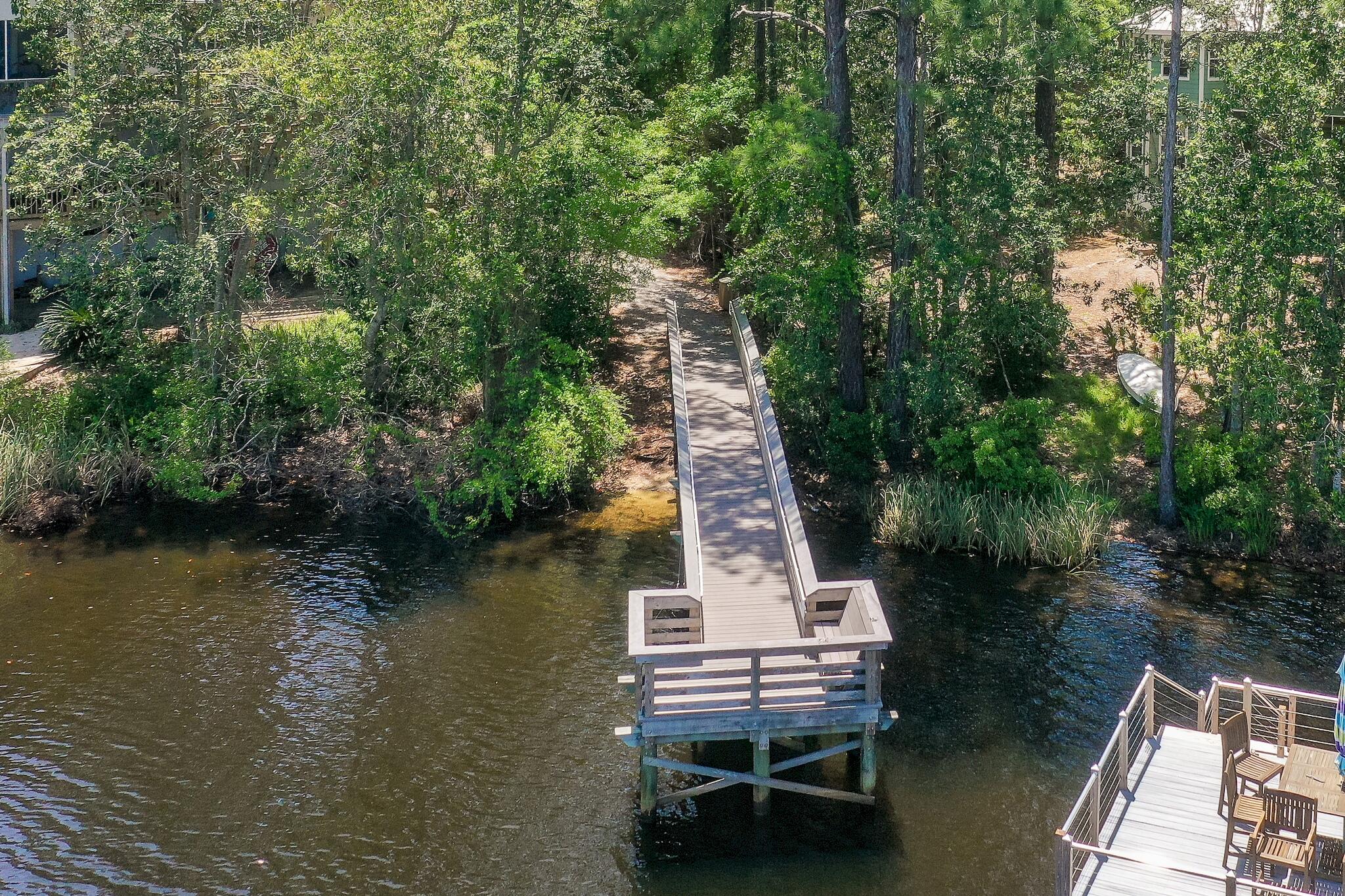 279 Pinewood Lane Inlet Beach, FL 32461 - Photo 45 of 48 an aerial view of a house with outdoor space lake view and trees all around