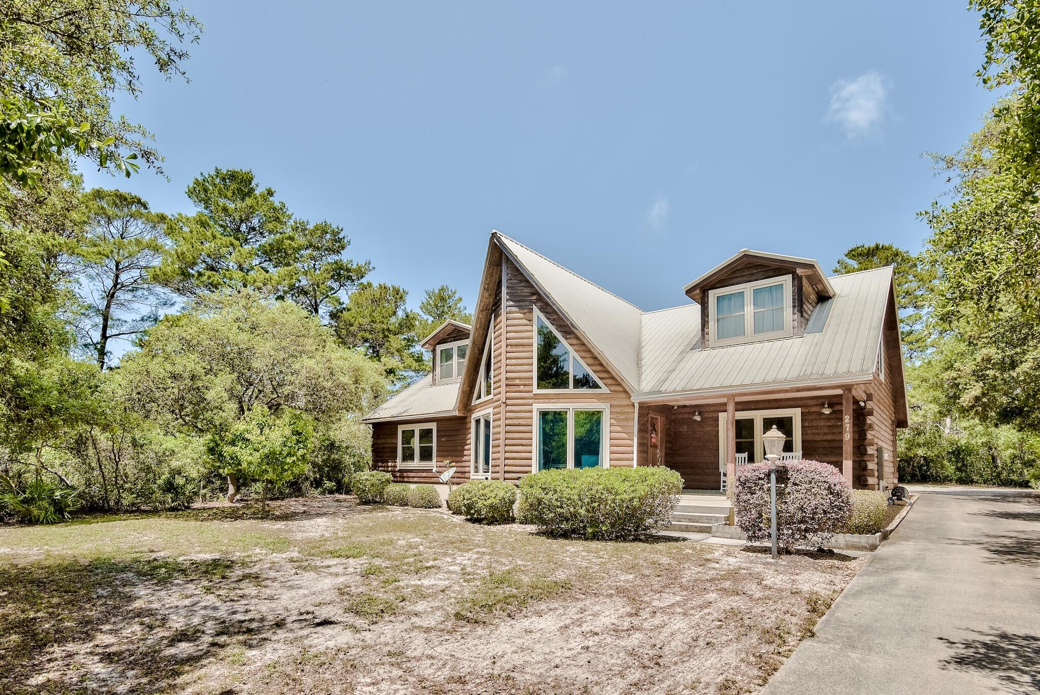 279 Pinewood Lane Inlet Beach, FL 32461 - Photo 48 of 48 a front view of a house with a yard