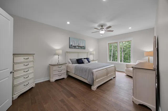 a bathroom with a glass door shower a sink and a mirror