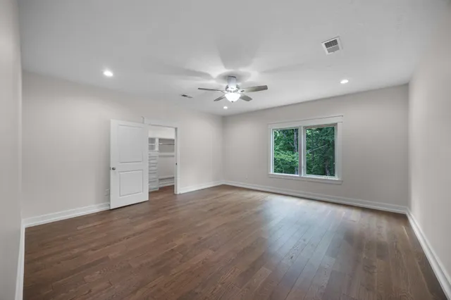 a view of a hallway with stairs