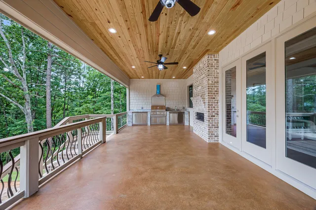 a view of porch with wooden floor