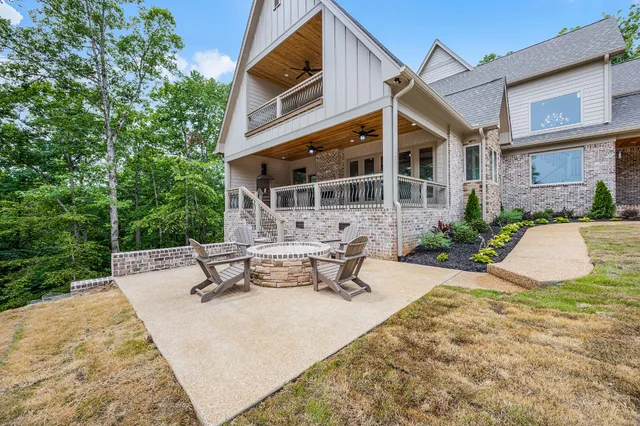 a view of a building with a backyard and sitting area