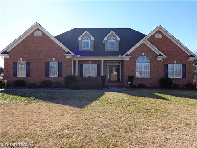 8124 Hawkins Road Clemmons, NC 27012 - Photo 1 of 9 Exterior Front. All brick one level living with beautiful curb appeal.