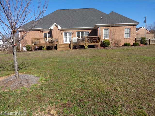 8124 Hawkins Road Clemmons, NC 27012 - Photo 2 of 9 Exterior Back. Enjoy privacy while relaxing on 33 X16 deck.