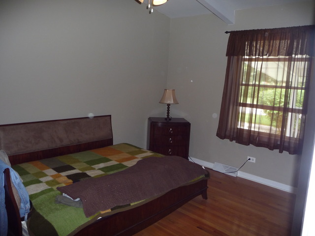 914 East Irving Park Road Itasca, IL 60143 - Photo 11 of 21 a bedroom with a bed and window