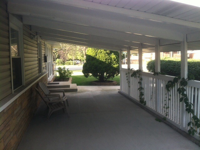 914 East Irving Park Road Itasca, IL 60143 - Photo 3 of 21 a view of a porch with furniture and a yard