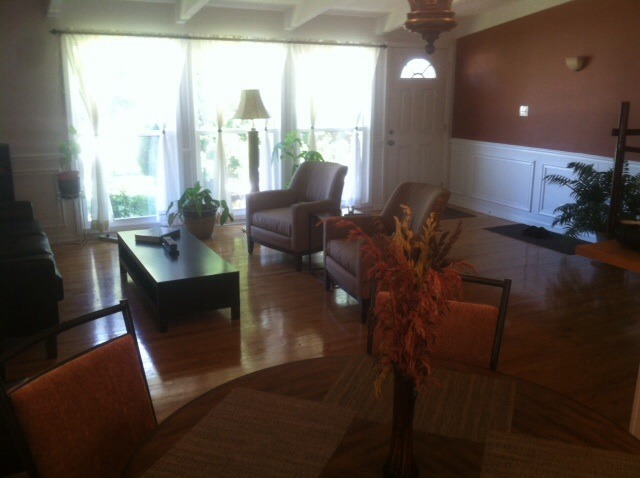 914 East Irving Park Road Itasca, IL 60143 - Photo 10 of 21 a living room with furniture and a floor to ceiling window