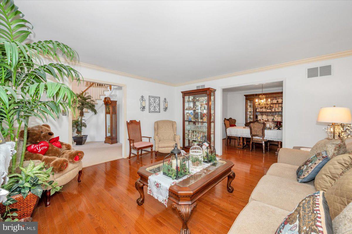 4810 Reyburn Court North Mount Airy, MD 21771 - Photo 13 of 61 a living room with furniture dining table and a potted plant