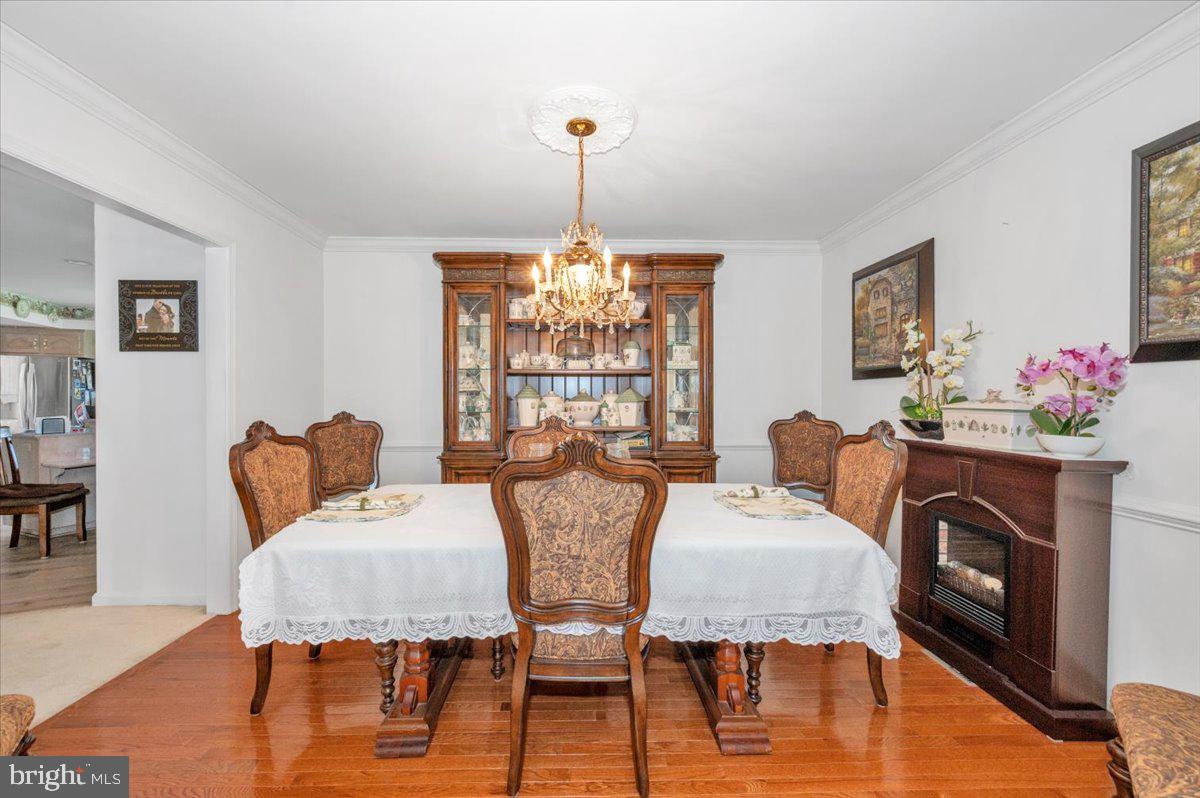 4810 Reyburn Court North Mount Airy, MD 21771 - Photo 14 of 61 a view of a dining room with furniture window and wooden floor