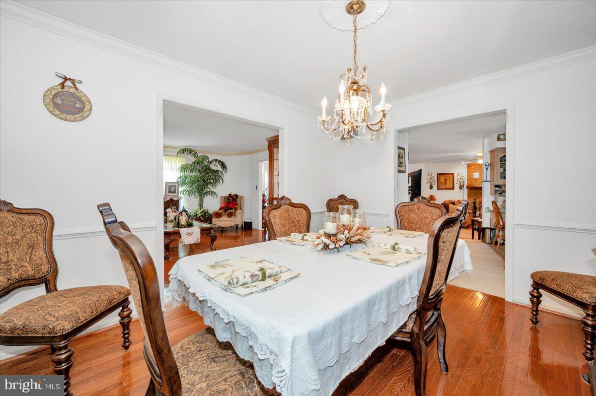4810 Reyburn Court North Mount Airy, MD 21771 - Photo 15 of 61 a view of a dining room with furniture and chandelier