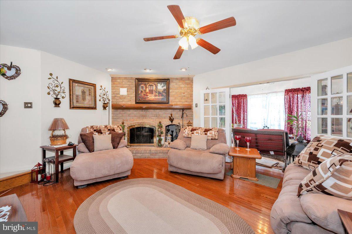 4810 Reyburn Court North Mount Airy, MD 21771 - Photo 16 of 61 a living room with fireplace furniture and a large window