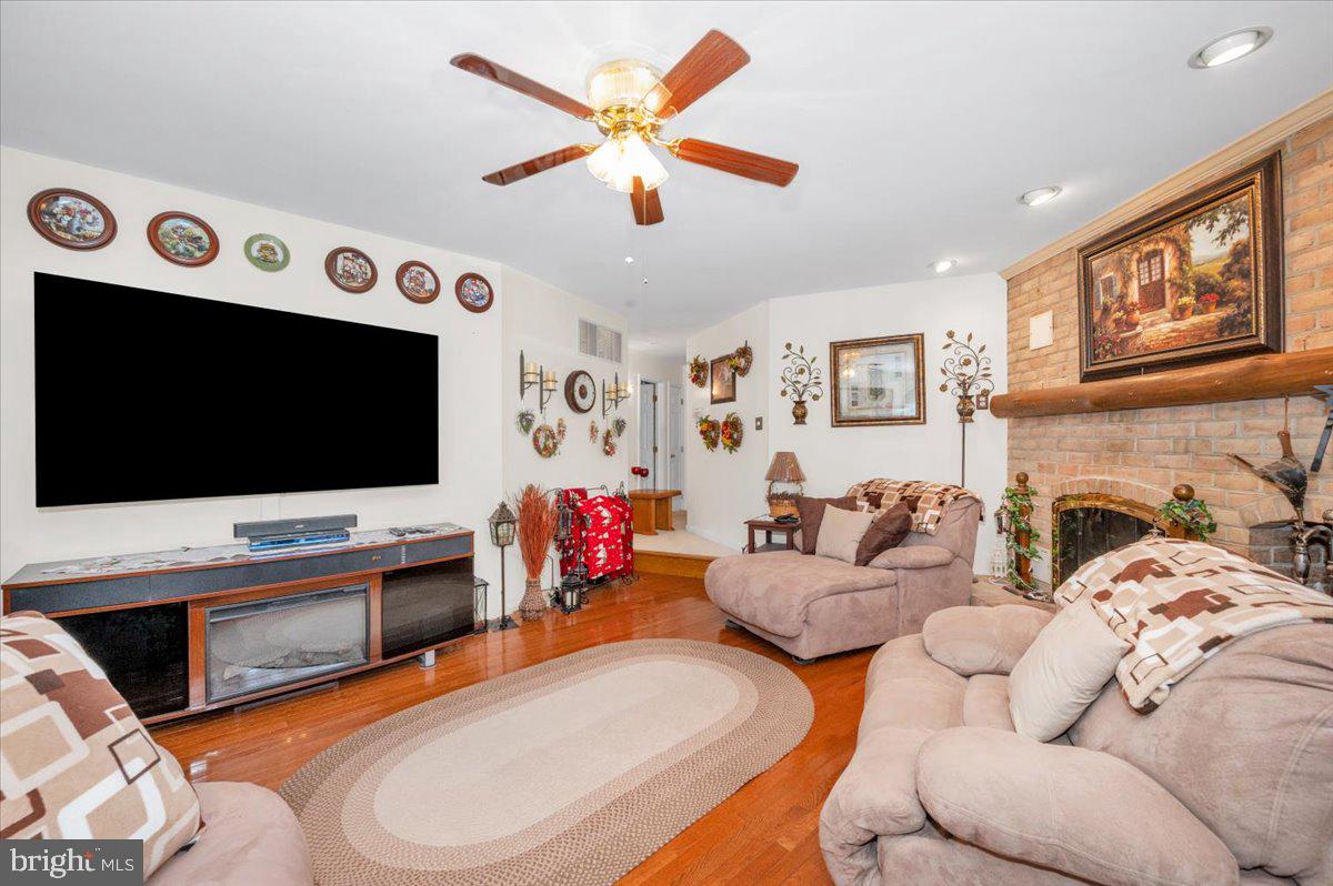 4810 Reyburn Court North Mount Airy, MD 21771 - Photo 18 of 61 a living room with fireplace furniture and a flat screen tv