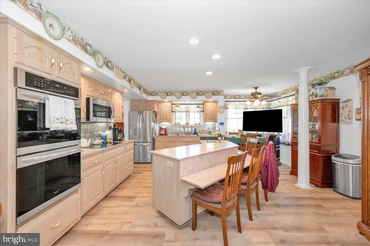 4810 Reyburn Court North Mount Airy, MD 21771 - Photo 21 of 61 a large kitchen with a table and chairs