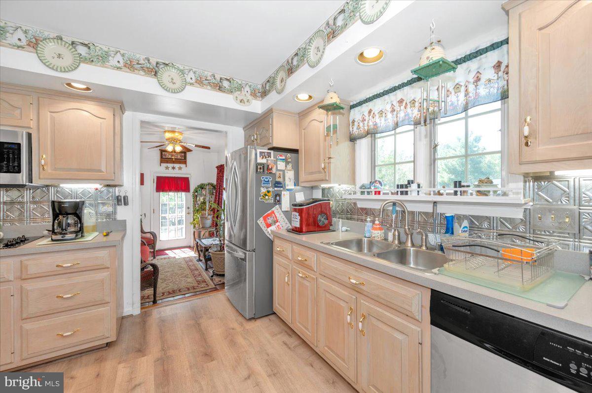 4810 Reyburn Court North Mount Airy, MD 21771 - Photo 24 of 61 a kitchen that has a lot of cabinets a sink and appliances in it