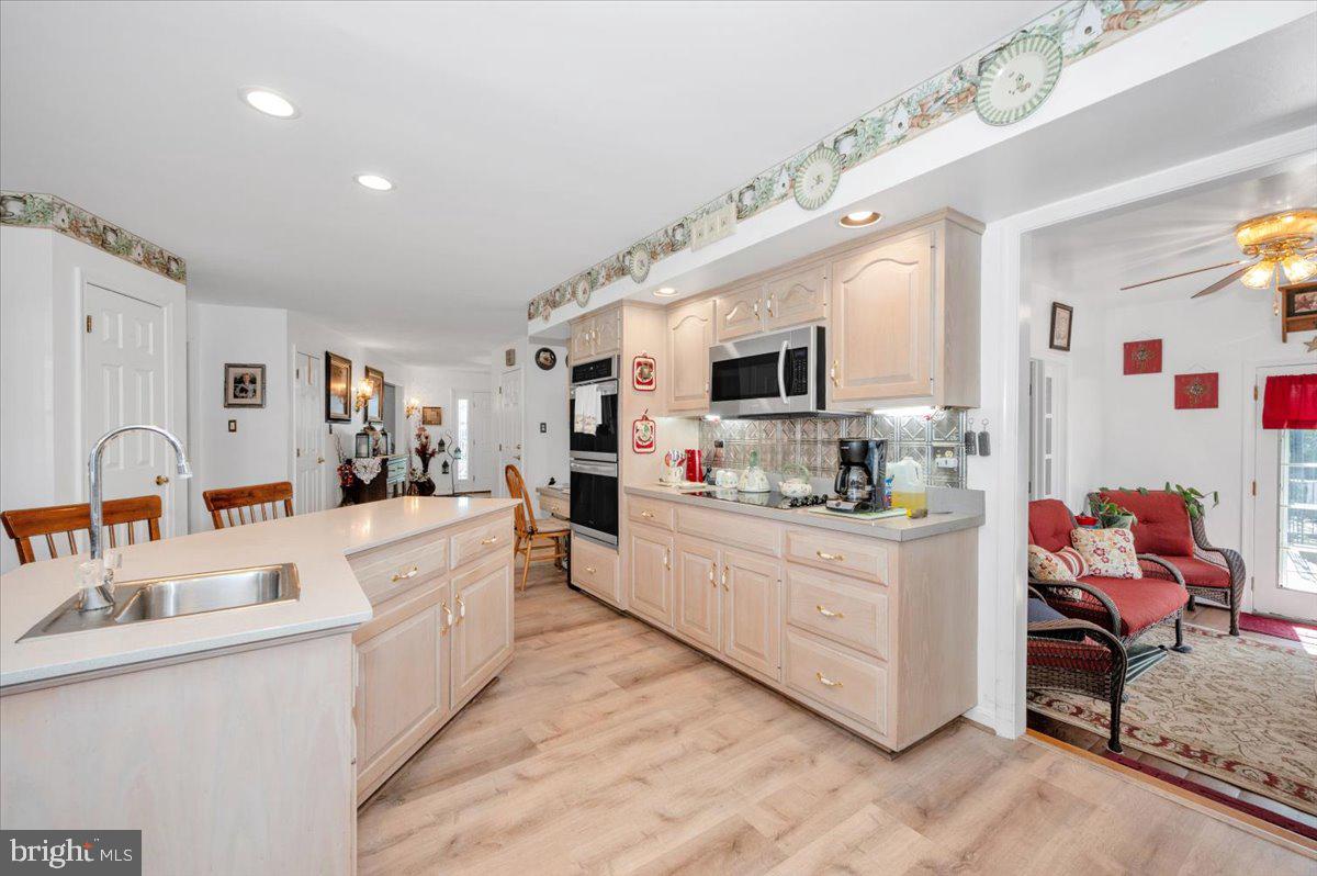 4810 Reyburn Court North Mount Airy, MD 21771 - Photo 28 of 61 a large white kitchen with stainless steel appliances granite countertop lots of counter top space