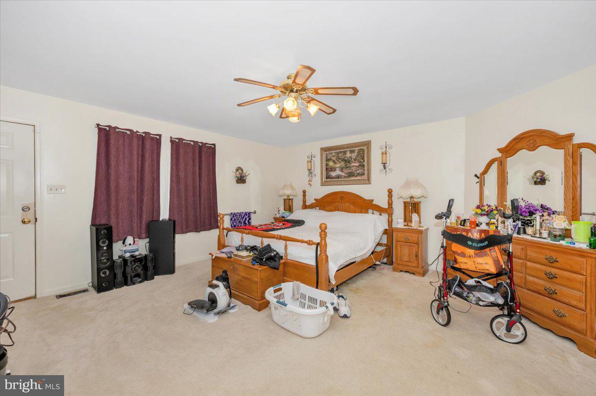 4810 Reyburn Court North Mount Airy, MD 21771 - Photo 36 of 61 Spacious bedroom with warm ambiance.