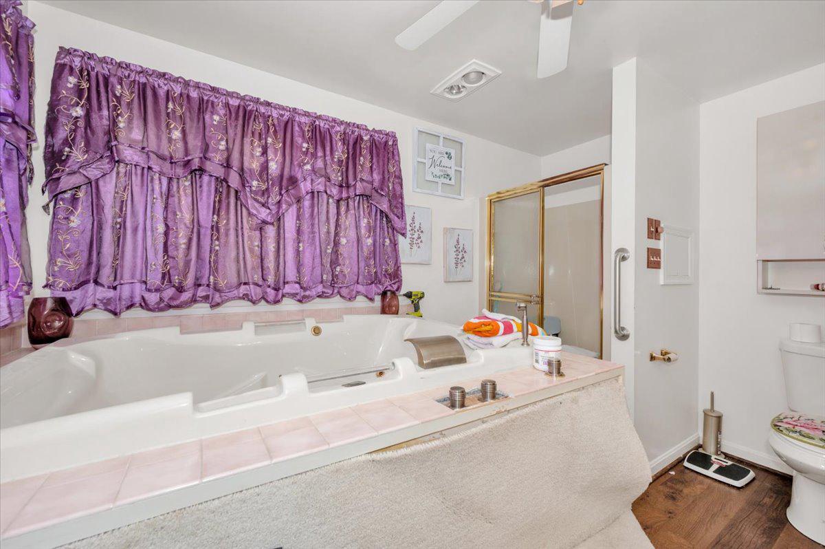 4810 Reyburn Court North Mount Airy, MD 21771 - Photo 40 of 61 a bathroom with a tub sink and mirror