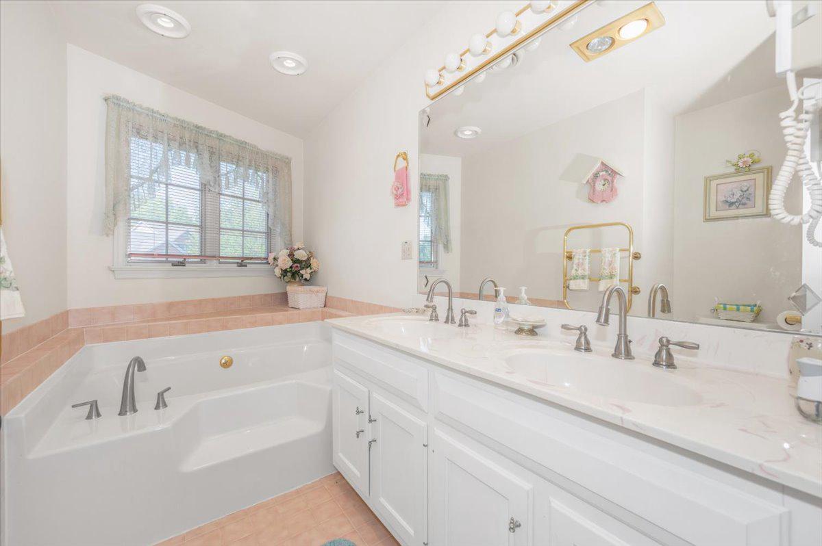 4810 Reyburn Court North Mount Airy, MD 21771 - Photo 48 of 61 a bathroom with a tub sink and mirror