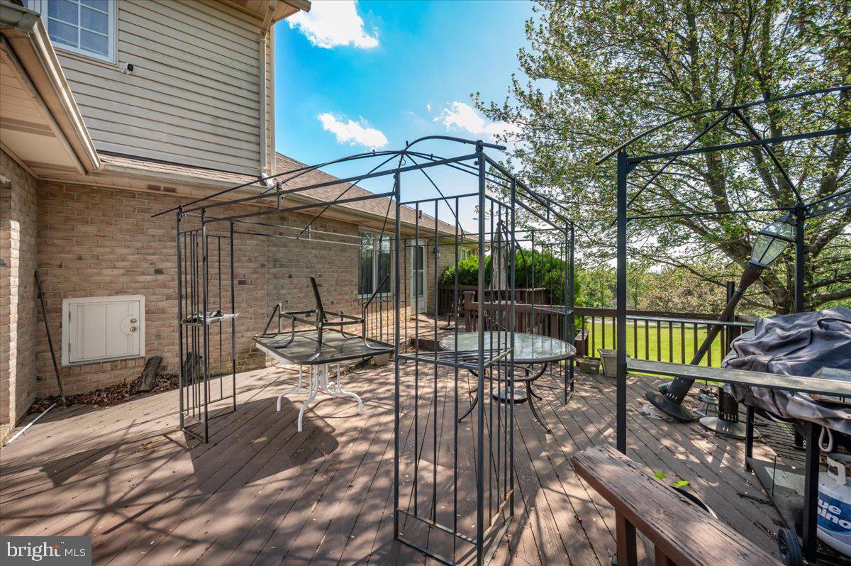 4810 Reyburn Court North Mount Airy, MD 21771 - Photo 57 of 61 a view of a patio with couches table and chairs and potted plants