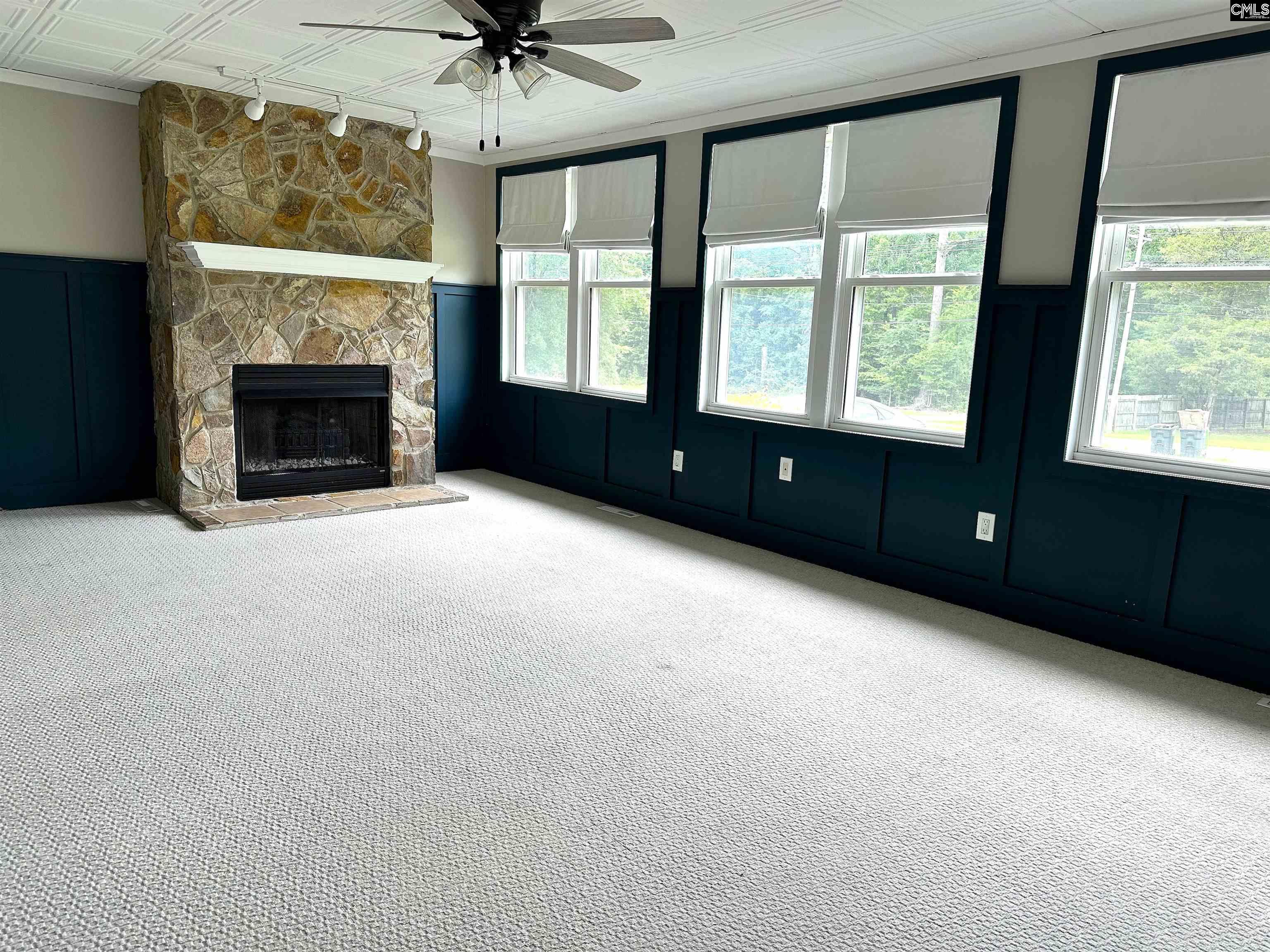 535 Sandbar Road Chapin, SC 29036 - Photo 15 of 23 a view of an empty room with a fireplace and a window