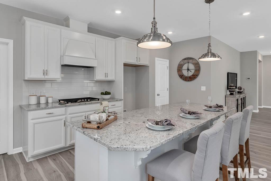 112 Thrower Lane Garner, NC 27529 - Photo 15 of 38 a kitchen with a table and chairs in it