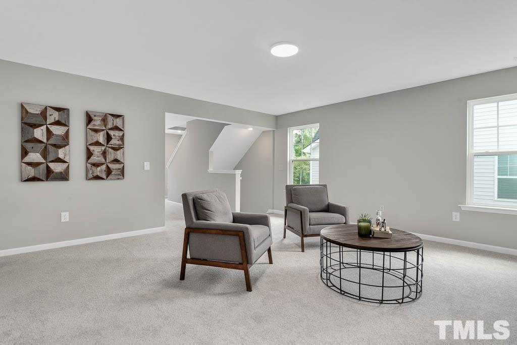 112 Thrower Lane Garner, NC 27529 - Photo 21 of 38 a living room with furniture and a window