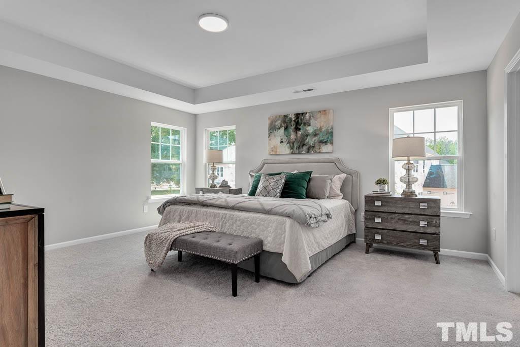 112 Thrower Lane Garner, NC 27529 - Photo 22 of 38 a bedroom with a bed and a window