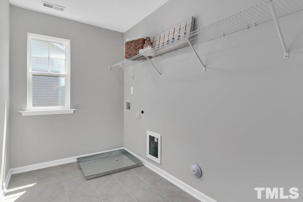 112 Thrower Lane Garner, NC 27529 - Photo 27 of 38 a view of a room with racks on the wall