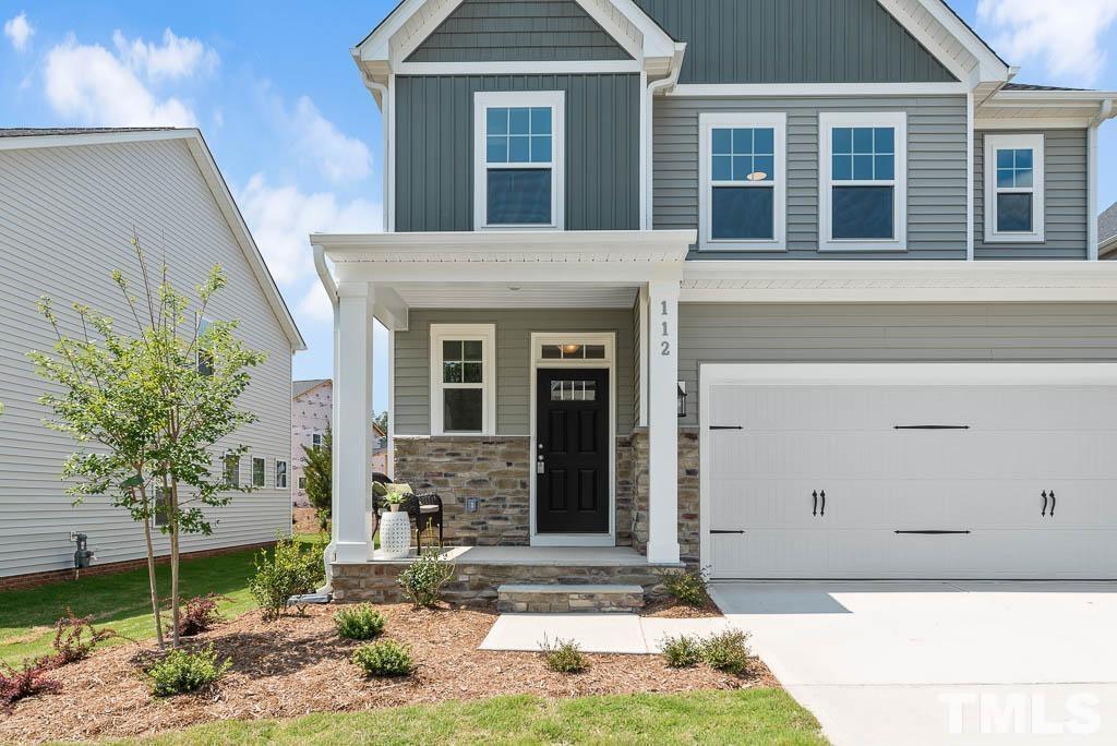 112 Thrower Lane Garner, NC 27529 - Photo 3 of 38 a front view of a house with garden