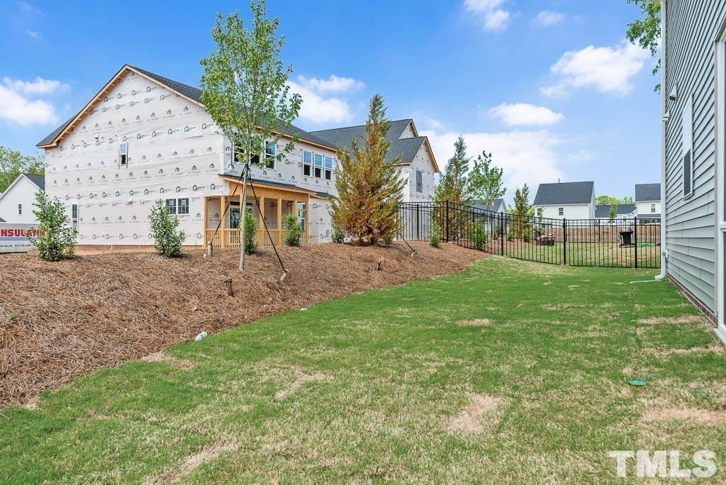 112 Thrower Lane Garner, NC 27529 - Photo 38 of 38 a view of a house with a big yard potted plants and large tree