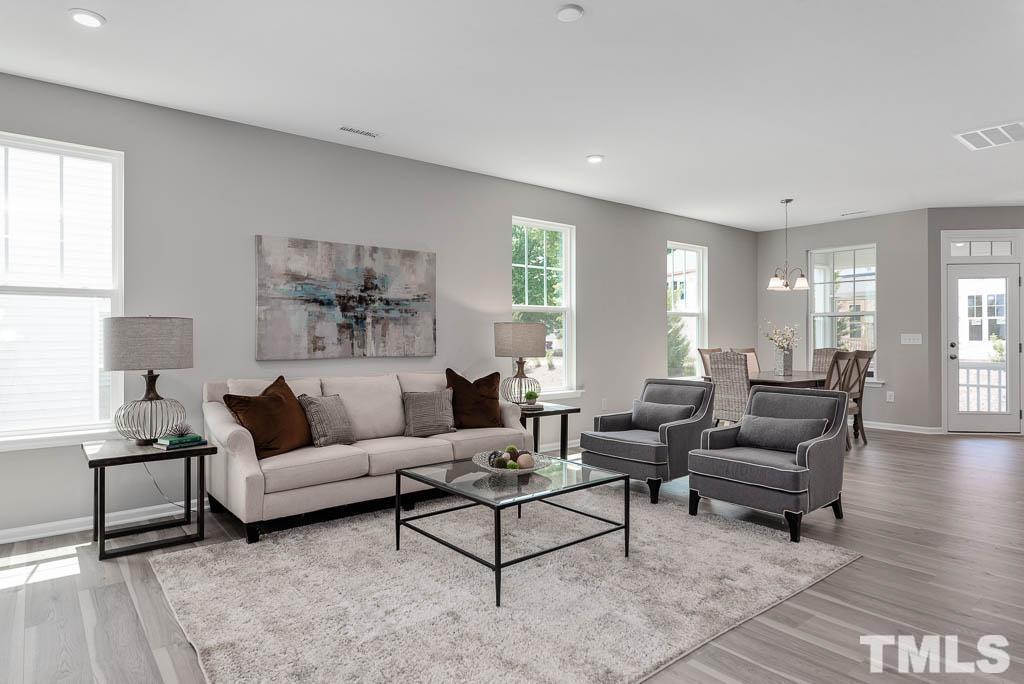 112 Thrower Lane Garner, NC 27529 - Photo 6 of 38 a living room with furniture and a large window