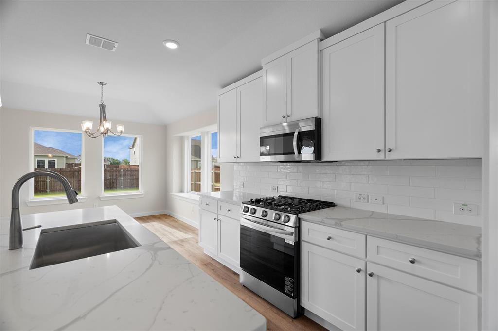 623 Kyle Drive Tioga, TX 76271 - Photo 12 of 40 a view of a kitchen with electric appliances